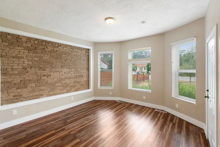 East unit. Neutral wall tones complementing wood-finish flooring
