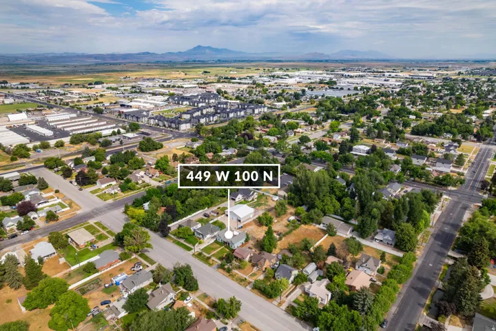 Aerial perspective showcasing the property at 449 W 100 N amidst a developed landscape