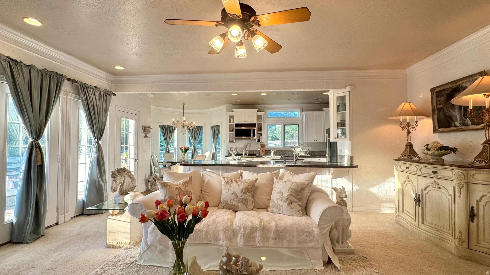 Living area with recessed lighting, wood-finish ceiling fan, and crown molding