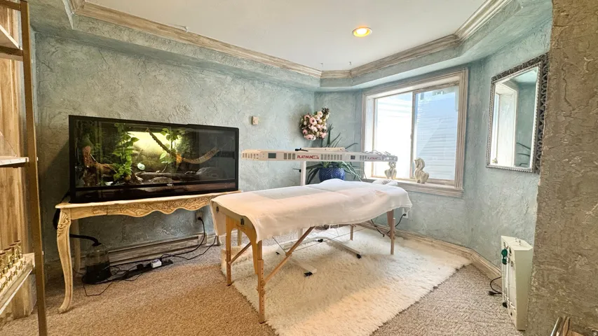 Room with textured plaster walls and a bay window