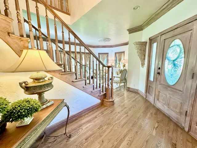 Light wood-finish flooring extending from the entryway