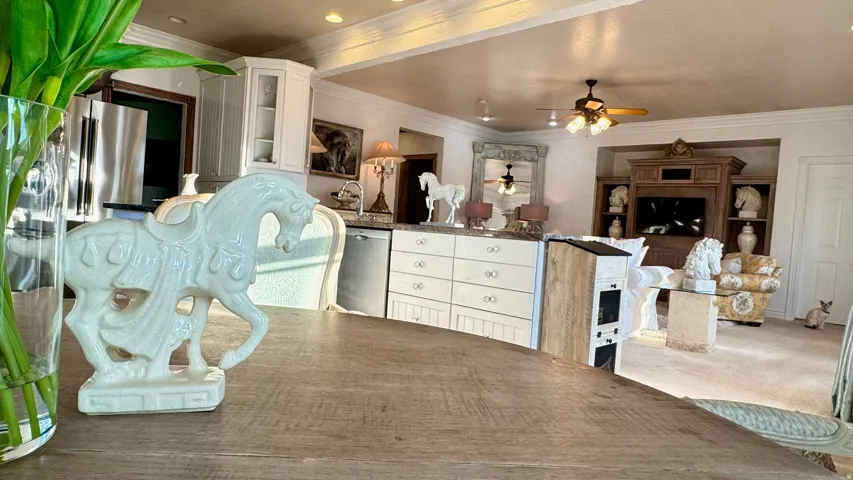 Open-concept living area featuring a wood-finish dining table