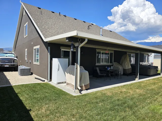 Expansive covered patio featuring a concrete surface and direct access to the interior