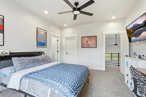Bedroom featuring light gray walls and coordinating carpet