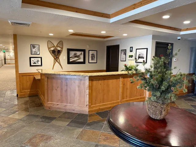 Warm wood paneling and trim complement the light-toned walls
