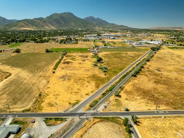 Expansive rural landscape featuring a network of roads and railway lines