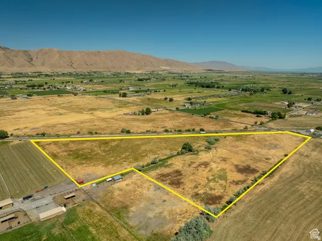 Expansive rural acreage featuring a natural landscape and surrounding agricultural fields
