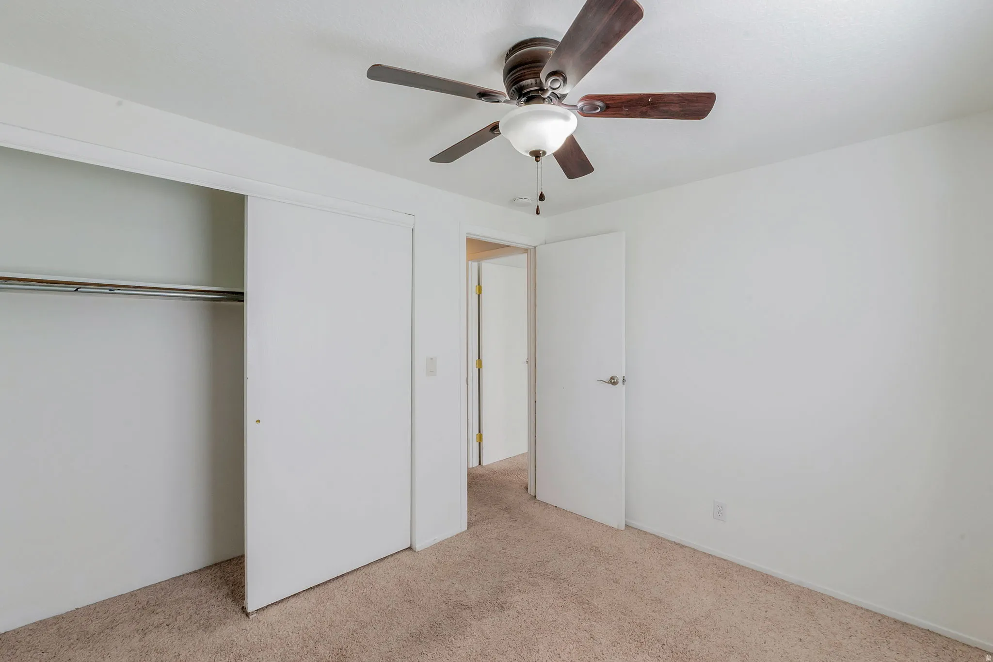 Light tan carpeting and neutral wall tones define this interior space