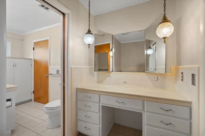 Vanity area in hall bathroom.