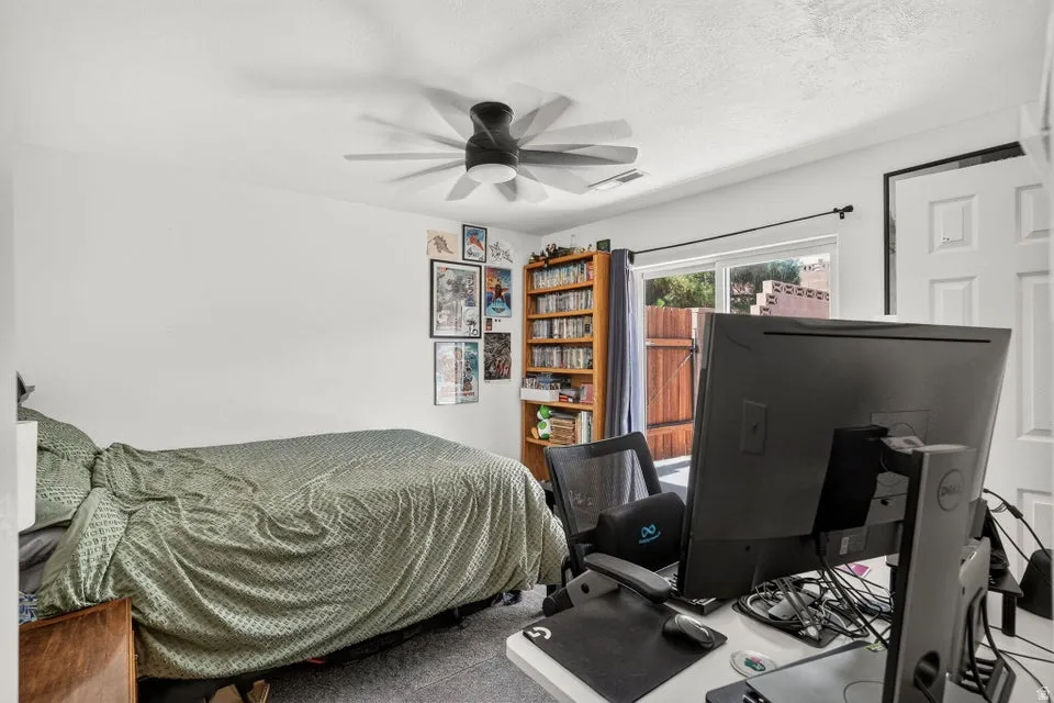 White walls and gray carpeting create a neutral palette