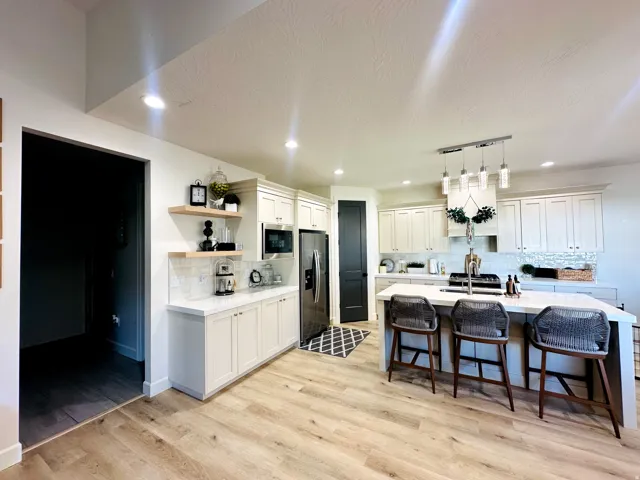 Modern kitchen with light wood-finish flooring