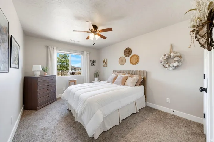 Bright bedroom with a window offering exterior landscape views