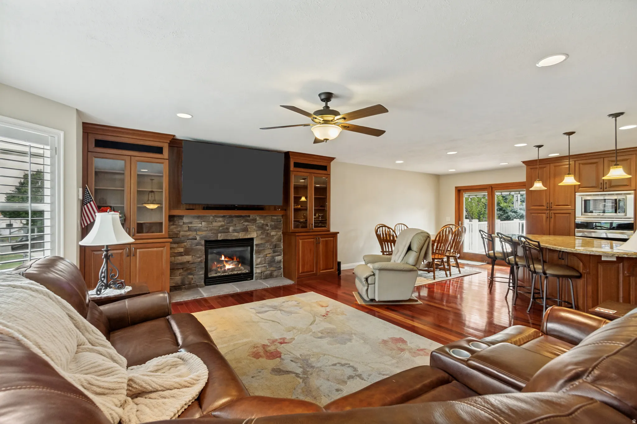 Open-concept living area with rich wood-finish flooring