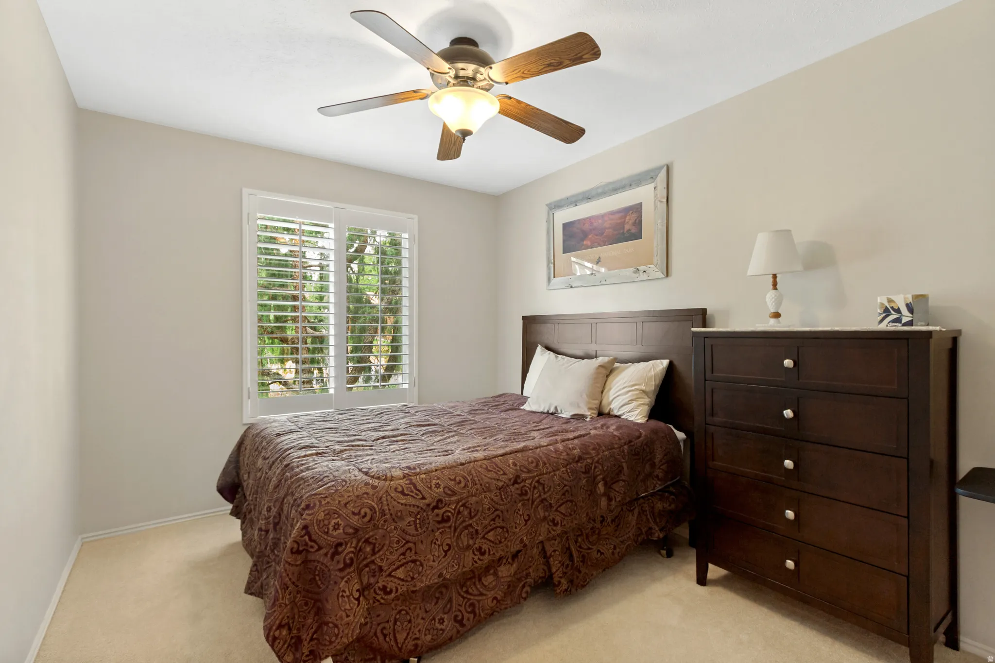 Neutral wall paint and carpeted flooring define this interior space