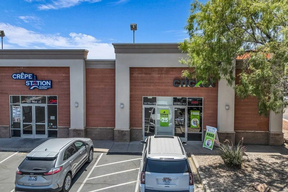 Commercial storefronts featuring brick facade accents and neutral-toned architectural elements