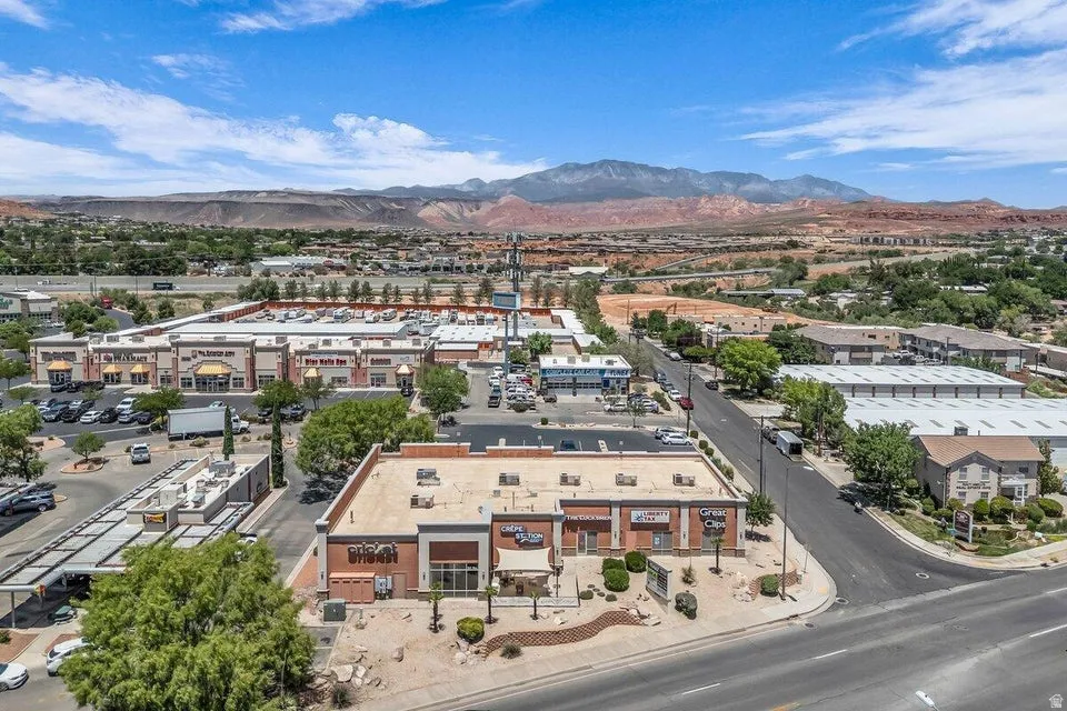 Aerial perspective showcasing a commercial building with brick and stucco facade