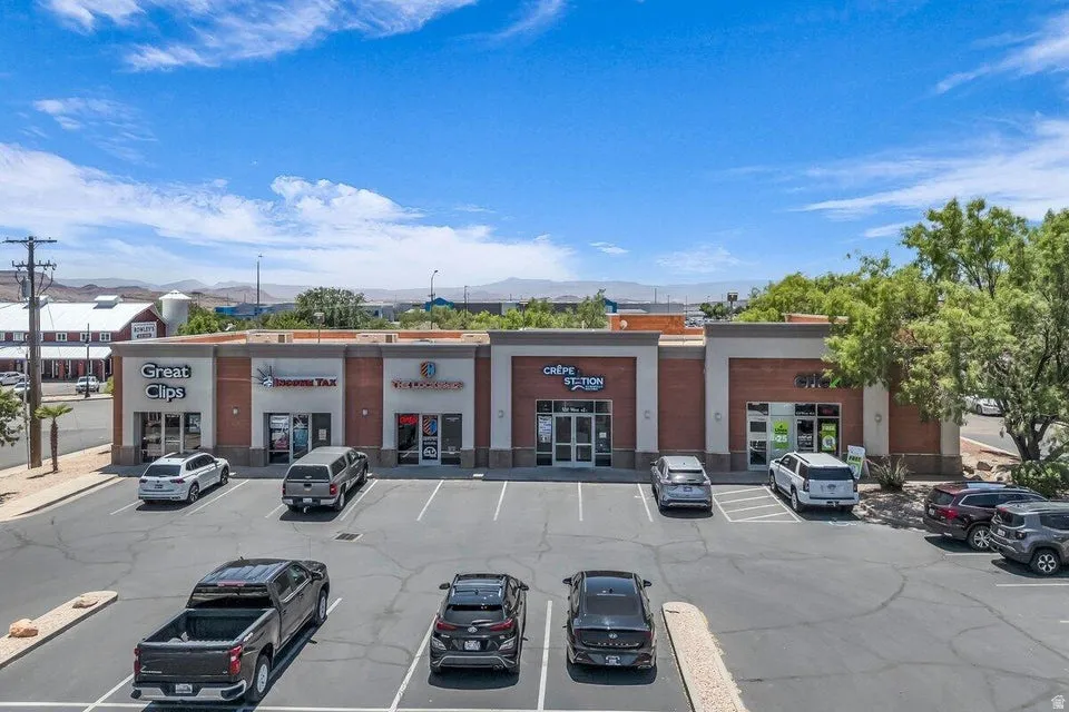 Commercial storefronts featuring brick and stucco facades