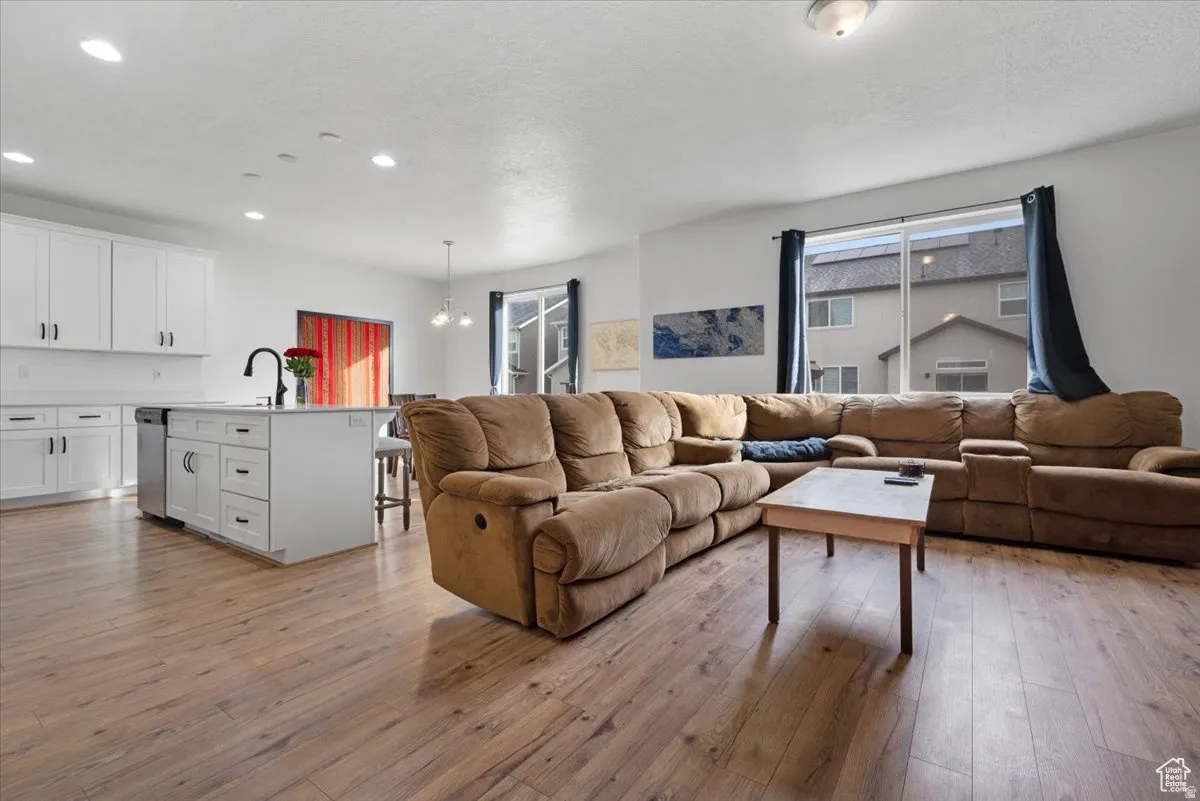 Open-concept living space with wood-finish flooring