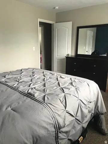 Master bedroom with Neutral wall paint throughout