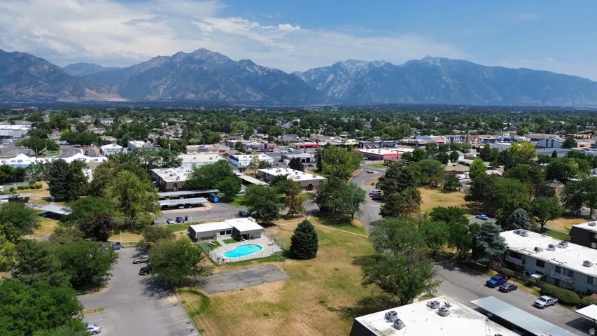 Expansive mountain range backdrop framing a residential and commercial district