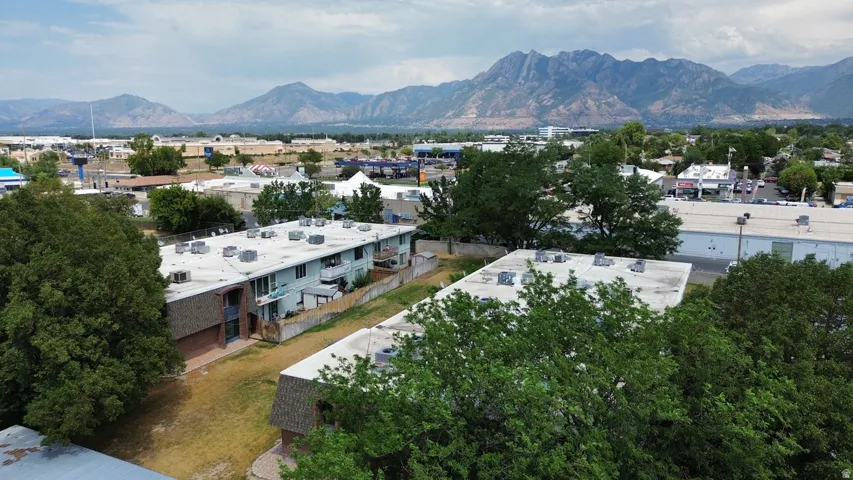 Multi-family property featuring two buildings with multiple units, flat roofs, and exterior balconies
