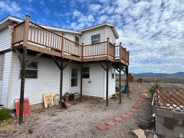 Upper-level wood deck with wood railings