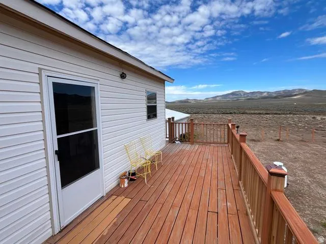 Expansive wood-finish deck with a natural wood railing