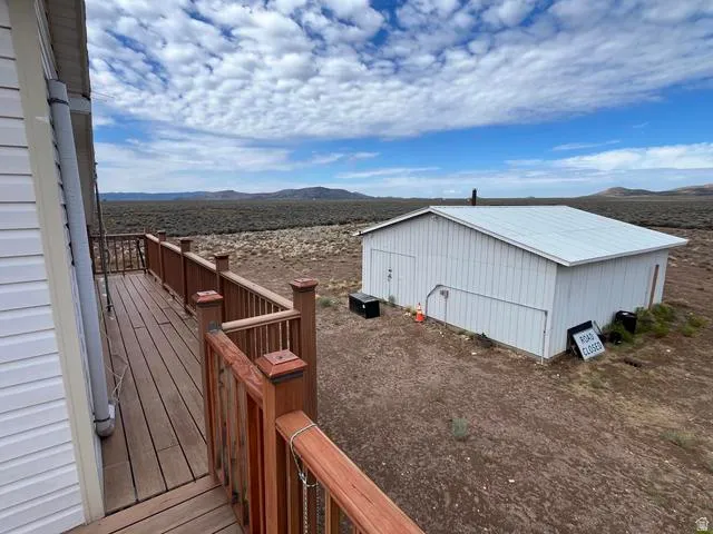 Expansive exterior decking with wood-finish railing