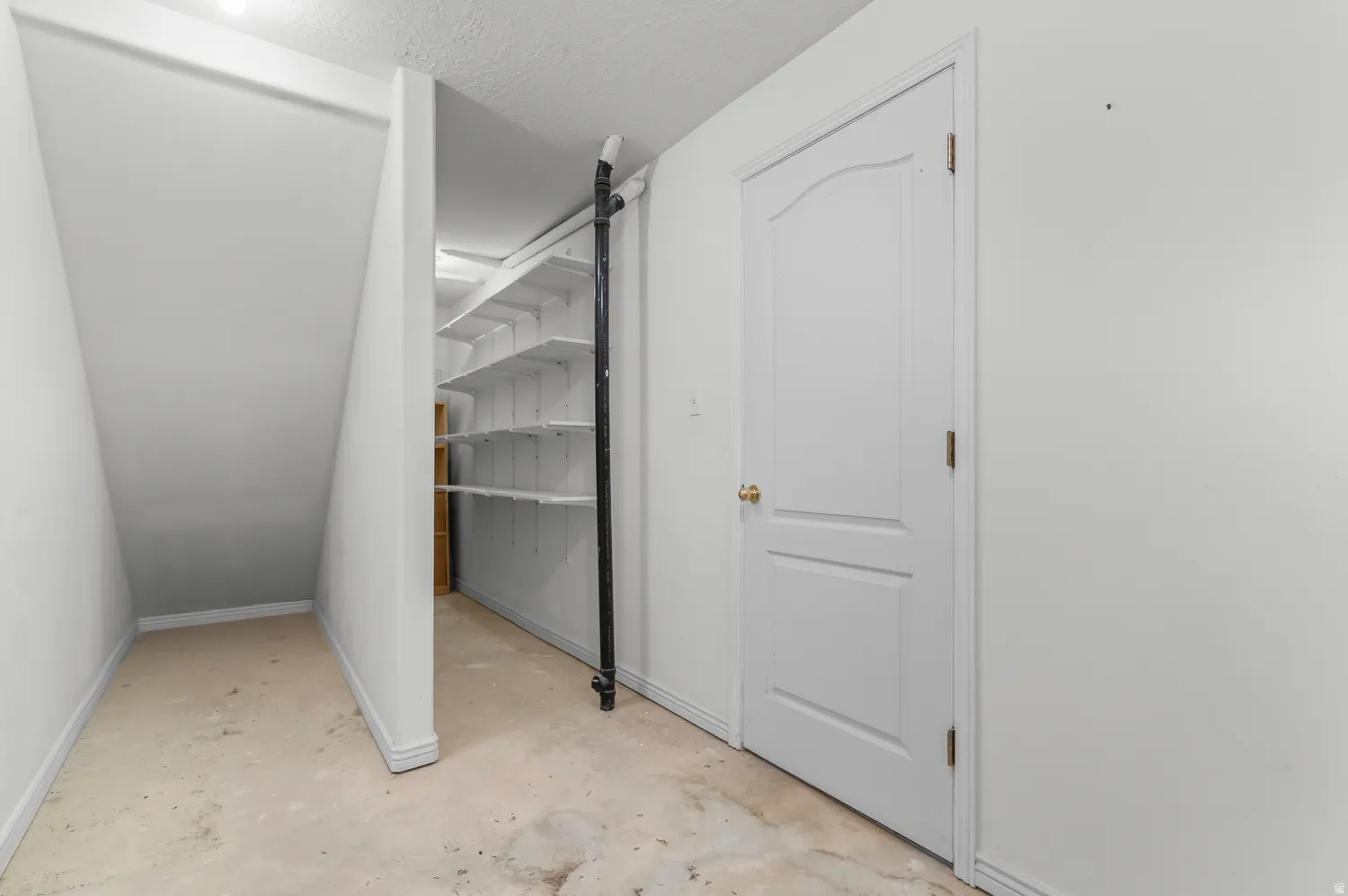 Dedicated storage area under staircase.