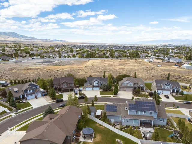 Residential neighborhood with single-family homes under a partly cloudy sky