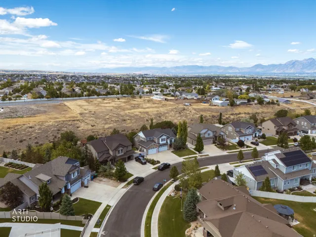 Suburban streetscape featuring a mix of traditional and contemporary residences