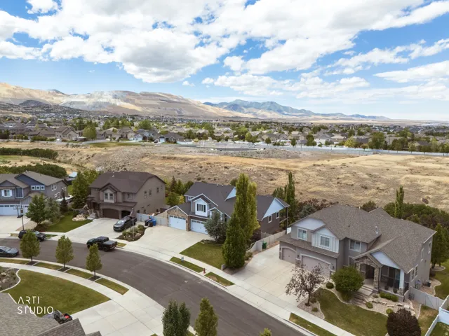 Residential neighborhood featuring single-family homes, paved streets, and landscaped yards