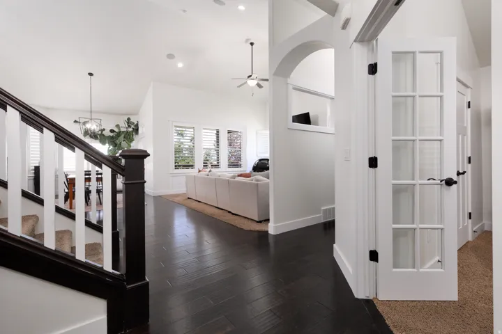 Dark wood-finish flooring extending through open-concept spaces