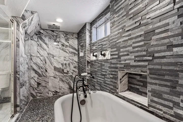 Freestanding soaking tub with black fixture