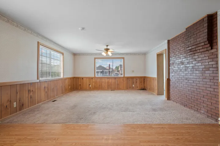 Large living room space with open living concept to dining and kitchen area.