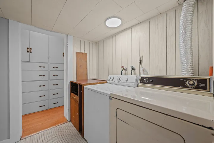 Laundry area located near both primary bedroom.