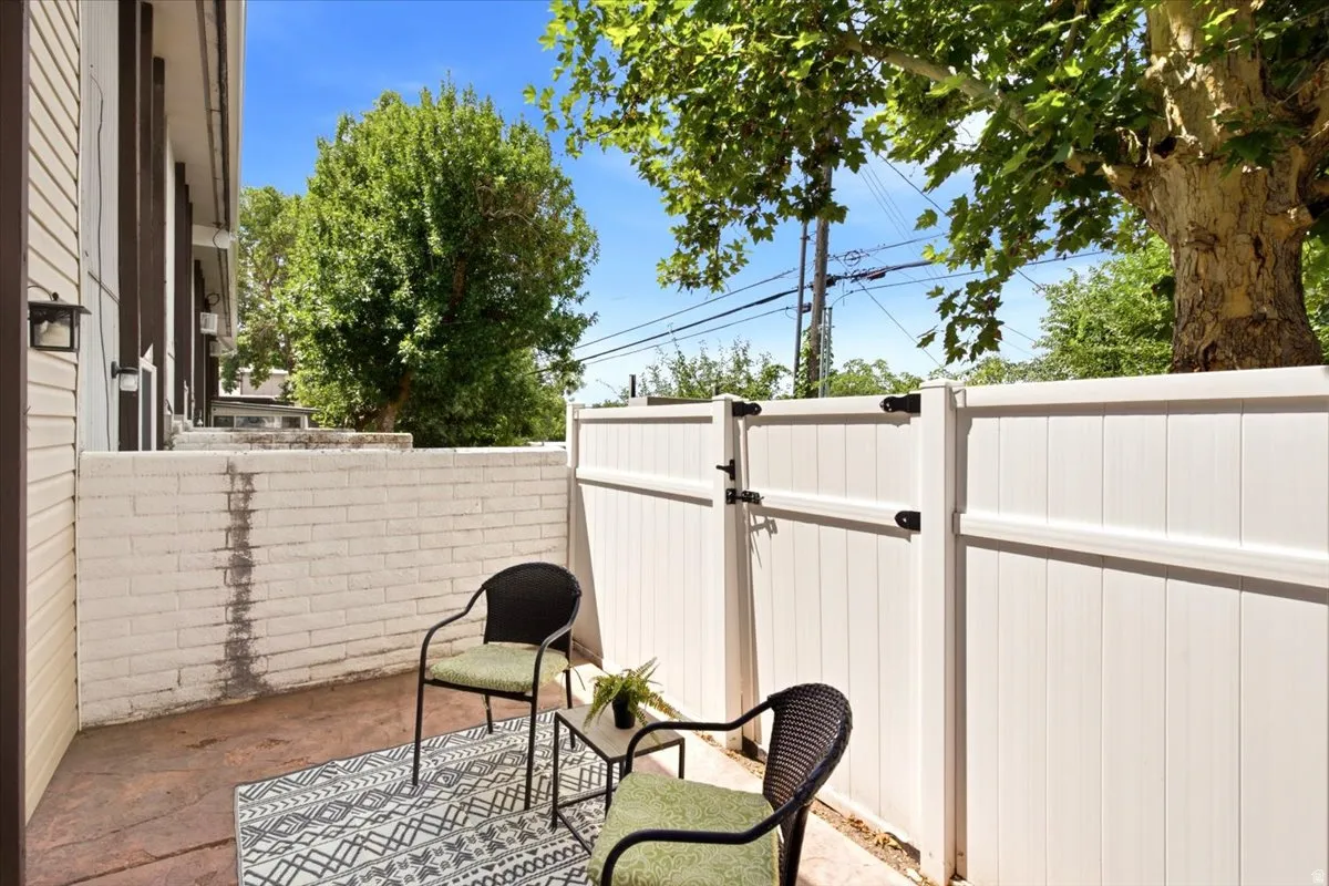 The 0.08-acre lot is larger than many comparable units and features two separate fenced patios