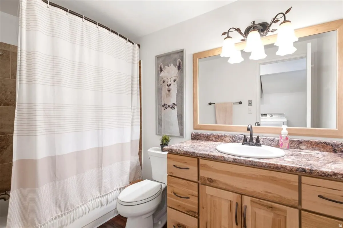 Remodeled bathrooms feature a new cast-iron tub, full tile surround, and soft-close cabinetry.