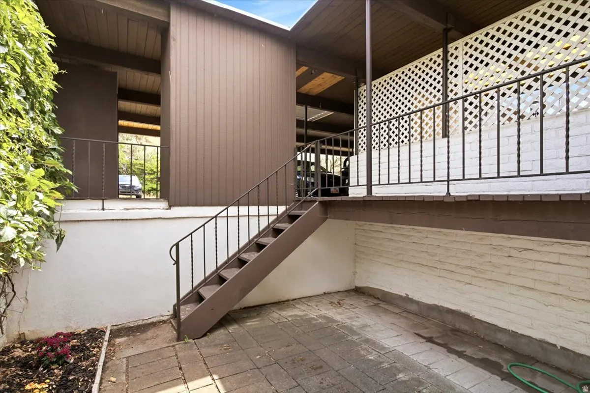 The 0.08-acre lot is larger than many comparable units and features two separate fenced patios