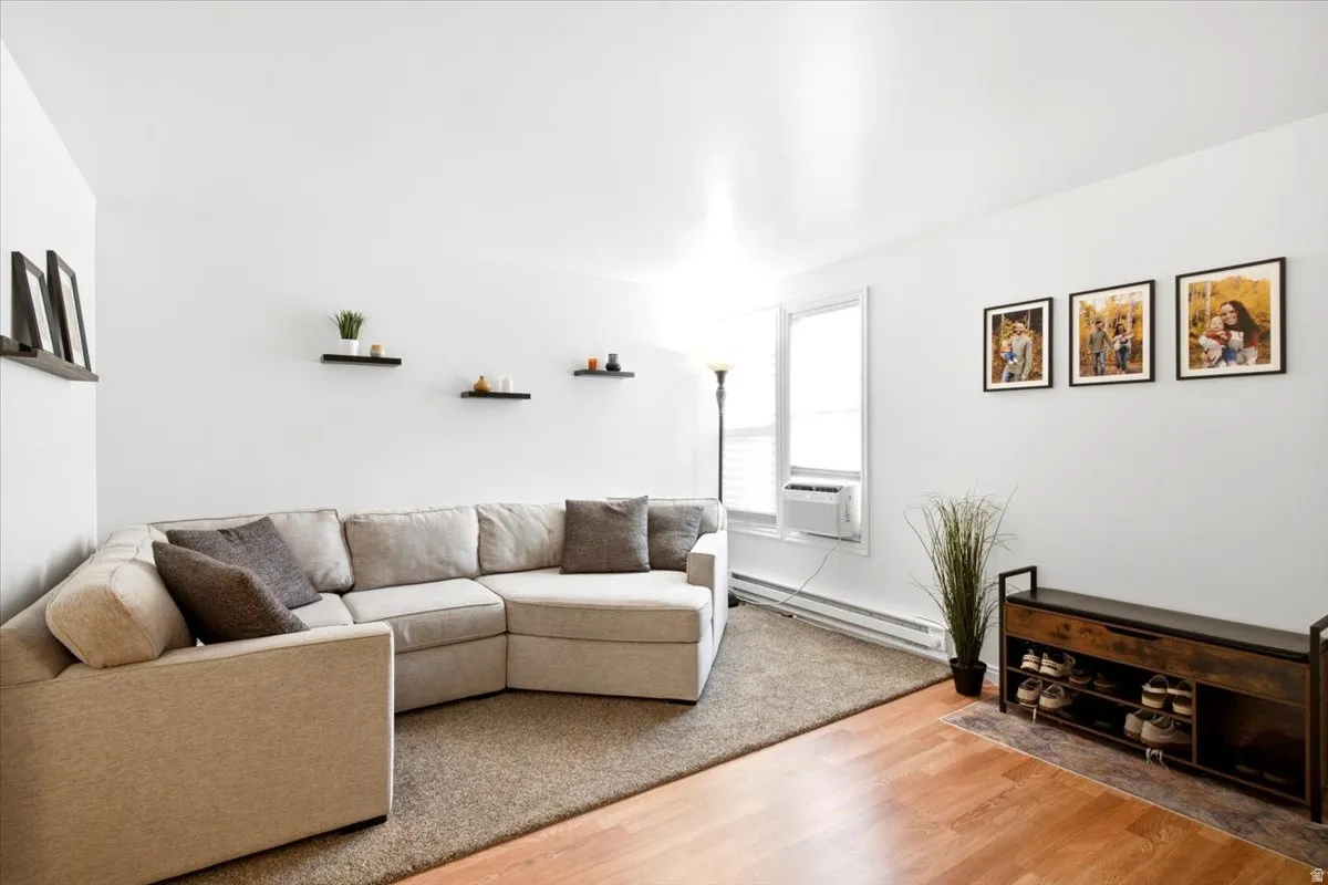 Newer carpet and laminate flooring, updated lighting and ceiling fans, new baseboard radiant heaters, triple-pane vinyl windows throughout, newer wrought iron railings with wood banisters, fresh paint, a newer sliding door with built-in privacy blinds