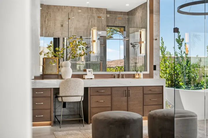 Contemporary bathroom featuring a floating vanity with a white countertop and wood-finish cabinetry