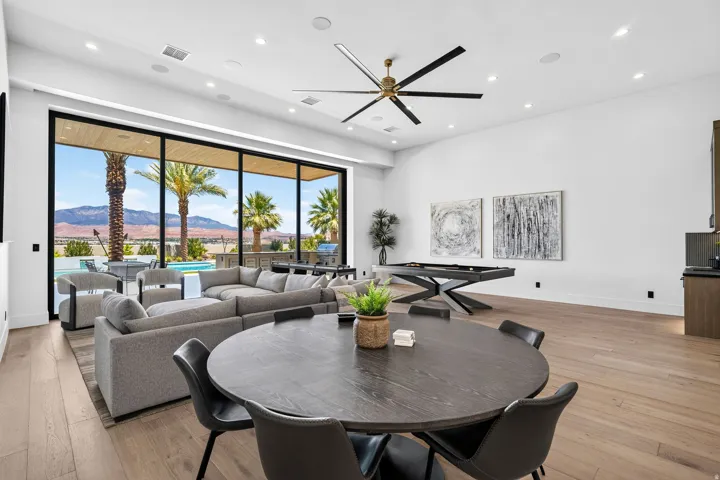 Expansive living area with wood-finish flooring and recessed lighting