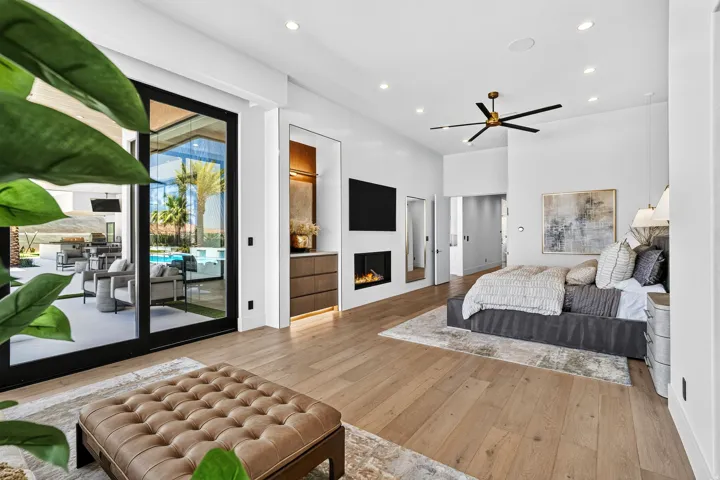 Bedroom featuring wood-finish flooring, recessed lighting, and a contemporary ceiling fan