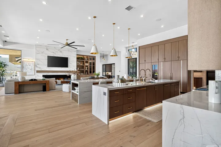 Open-concept living space featuring wide plank wood-finish flooring
