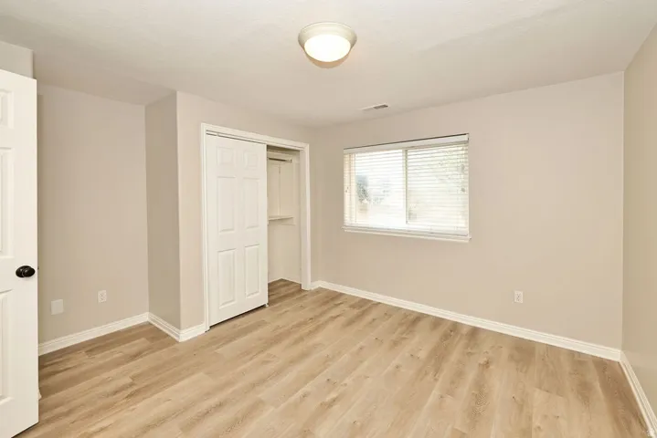 Neutral-toned walls complementing wood-finish flooring