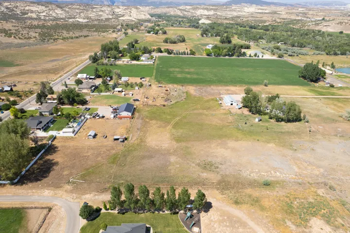 Expansive rural landscape featuring a mix of cultivated fields and undeveloped land