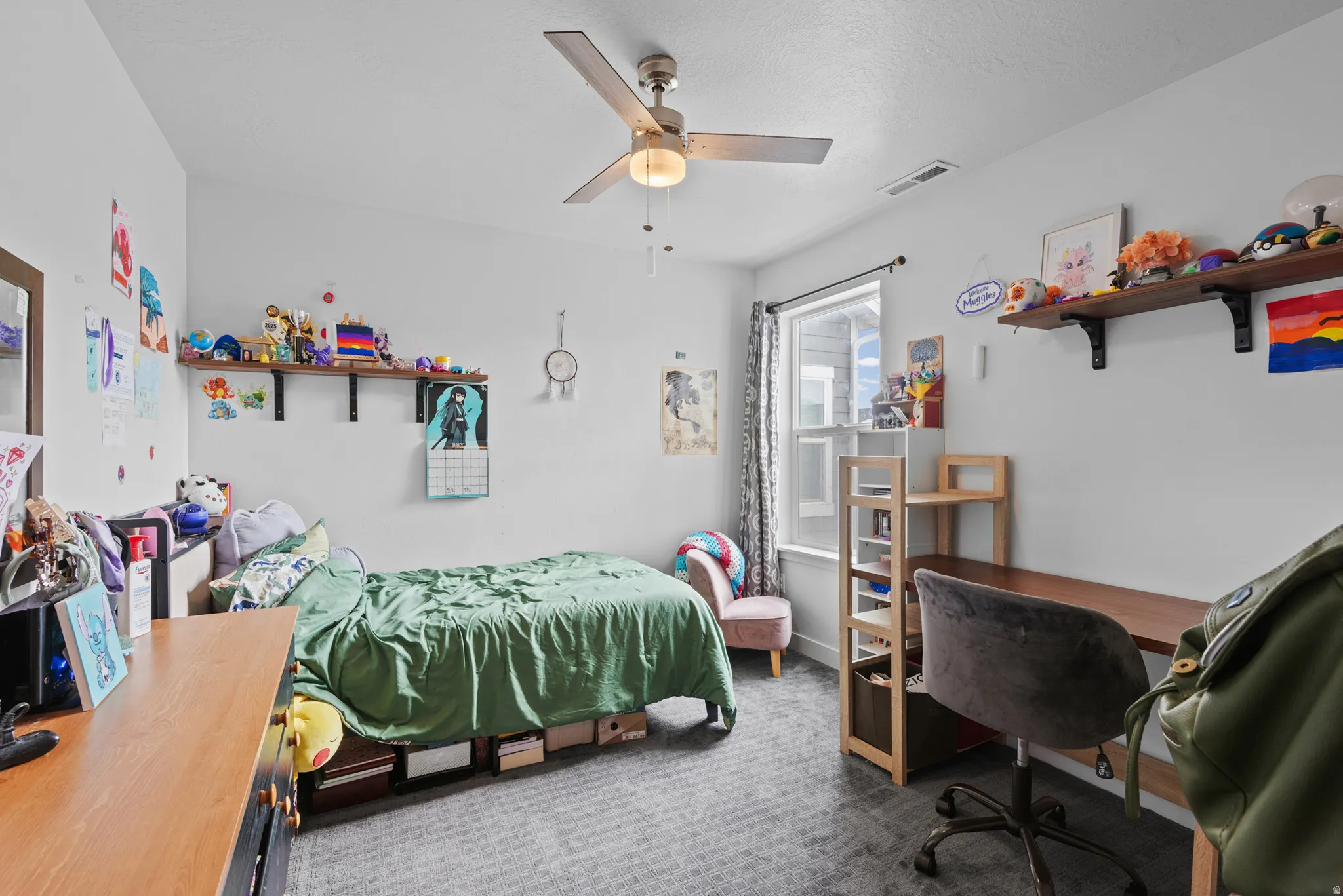 Carpeted room with a ceiling fan light fixture, recessed lighting, and a window with a curtain rod