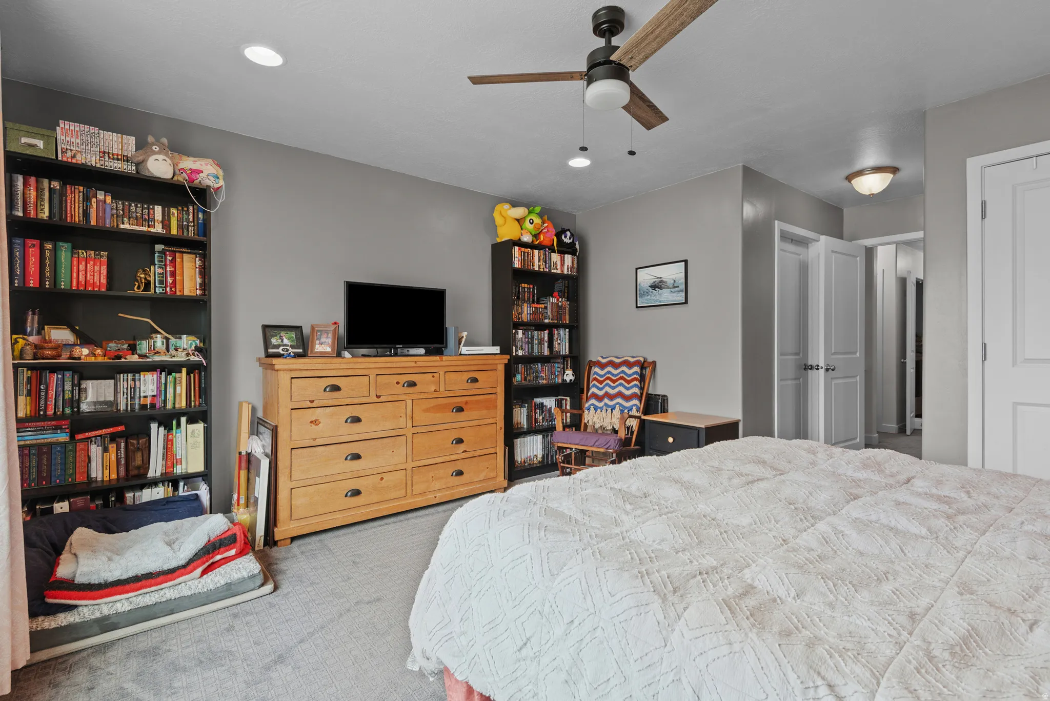 Bedroom featuring light gray wall paint and gray carpeting