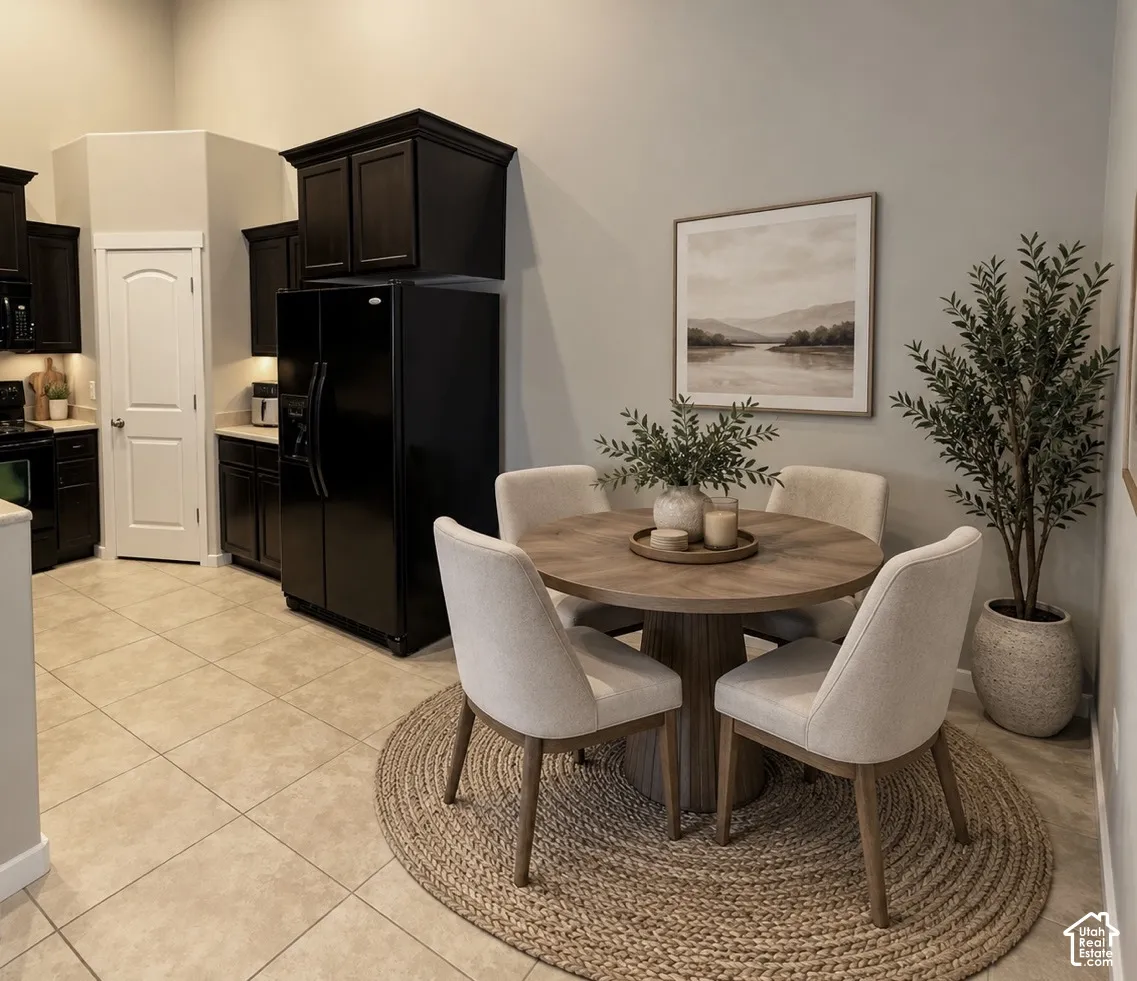 Kitchen featuring dark wood cabinetry, tile flooring, and a six-panel door