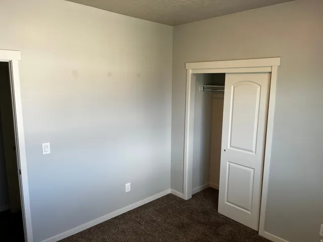 Recessed closet with a bi-fold door and interior hanging rod